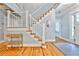 Inviting foyer with hardwood floors, elegant staircase, and natural light at 1658 East Clifton Rd, Atlanta, GA 30307