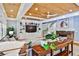 Bright living room with fireplace, built-in shelving, wood ceilings, and lots of natural light at 1658 East Clifton Rd, Atlanta, GA 30307
