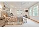 Bright main bedroom with large windows, neutral decor, and decorative ceiling fan at 1658 East Clifton Rd, Atlanta, GA 30307