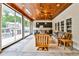 Enjoy this patio with bar, great furniture, ceiling fans, and folding glass doors leading inside at 1658 East Clifton Rd, Atlanta, GA 30307