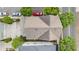 Overhead view of a home with a brown roof, driveway, street, and several cars nearby at 169 Waterman Se St, Marietta, GA 30060