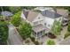 Aerial view of a neighborhood with a white two-story house featuring a screened porch at 169 Waterman Se St, Marietta, GA 30060
