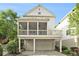 Rear exterior of home with a screened-in porch and a balcony above a two-car garage at 169 Waterman Se St, Marietta, GA 30060