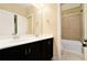 Bathroom with a double sink vanity and a tiled shower-tub combo at 169 Waterman Se St, Marietta, GA 30060