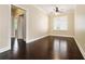 Bedroom with hardwood floors, neutral walls, white trim, and bright windows with plantation shutters at 169 Waterman Se St, Marietta, GA 30060