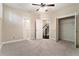 Carpeted bedroom with attached stairway access and a sizable closet with exposed shelving at 169 Waterman Se St, Marietta, GA 30060