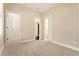 A carpeted bedroom features a walk-in closet and an additional room connected via a doorway at 169 Waterman Se St, Marietta, GA 30060