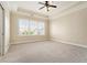Bedroom featuring carpeted floor and tray ceiling with white trim at 169 Waterman Se St, Marietta, GA 30060