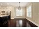 Dining area with hardwood floors, designer lighting, and plantation shutters at 169 Waterman Se St, Marietta, GA 30060
