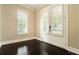 Bright entryway with hardwood floors, white trim, and plantation shutters at 169 Waterman Se St, Marietta, GA 30060