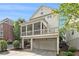 Two-story home with a screened-in porch above a two-car garage at 169 Waterman Se St, Marietta, GA 30060