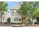 Charming two-story home featuring a gable roof, complemented by a lush, tree-lined street at 169 Waterman Se St, Marietta, GA 30060