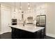 Modern kitchen featuring white cabinets, stainless steel appliances, and a dark island at 169 Waterman Se St, Marietta, GA 30060