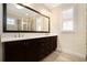 Main bathroom boasting double vanities, dark cabinets, framed mirror, and great lighting at 169 Waterman Se St, Marietta, GA 30060