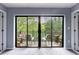 Balcony featuring two chairs, plants, and serene views of lush trees at 27306 Plantation Ne Dr, Atlanta, GA 30324