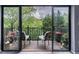 Relaxing balcony with seating and scenic views of the surrounding greenery at 27306 Plantation Ne Dr, Atlanta, GA 30324