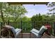 Charming outdoor balcony featuring comfortable chairs and lush, natural surroundings at 27306 Plantation Ne Dr, Atlanta, GA 30324