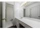 Bright bathroom featuring a vanity with a mirror and a separate shower room at 27306 Plantation Ne Dr, Atlanta, GA 30324