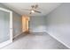 Spacious bedroom with neutral carpet and ceiling fan, offering a serene and comfortable living space at 27306 Plantation Ne Dr, Atlanta, GA 30324