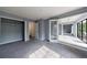 Bright bedroom features a walk-in closet, balcony access, and a neutral color palette at 27306 Plantation Ne Dr, Atlanta, GA 30324