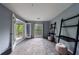 Cozy bedroom with natural light from the window and access to the balcony at 27306 Plantation Ne Dr, Atlanta, GA 30324