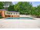 Large community swimming pool with ample deck space and building backdrop at 27306 Plantation Ne Dr, Atlanta, GA 30324