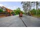 Community entrance with a gated entry and mature trees at 27306 Plantation Ne Dr, Atlanta, GA 30324