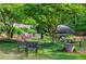 Relaxing garden area with comfortable seating, shade, and beautiful landscaping at 27306 Plantation Ne Dr, Atlanta, GA 30324