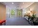 Well-lit hallway with large windows and neutral decor complements the building's aesthetics at 27306 Plantation Ne Dr, Atlanta, GA 30324
