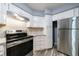 Well-equipped kitchen with stainless steel appliances, granite countertops, and sleek cabinetry for modern living at 27306 Plantation Ne Dr, Atlanta, GA 30324