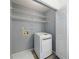 Efficient laundry area with washer and shelving provides convenience and organization at 27306 Plantation Ne Dr, Atlanta, GA 30324