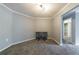 Bonus room with neutral color carpet, decorative lighting, and open doorway plus neutral grey walls at 27306 Plantation Ne Dr, Atlanta, GA 30324