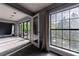 Spacious living room with large windows and access to a private balcony at 27306 Plantation Ne Dr, Atlanta, GA 30324