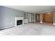 Spacious living room showcasing a fireplace, built-in shelving, and an open layout, with neutral carpet at 27306 Plantation Ne Dr, Atlanta, GA 30324