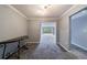 Open-concept living room with view of a leafy yard at 27306 Plantation Ne Dr, Atlanta, GA 30324
