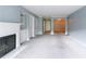 Bright living room with fireplace and carpeting offering a cozy and inviting space at 27306 Plantation Ne Dr, Atlanta, GA 30324