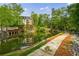 Scenic community grounds with lush greenery, water features, and walking paths at 27306 Plantation Ne Dr, Atlanta, GA 30324