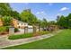 Community pool area with manicured landscaping and shaded seating at 27306 Plantation Ne Dr, Atlanta, GA 30324