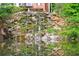 Scenic waterfall cascading down a rocky cliffside, reflecting in the pond at 27306 Plantation Ne Dr, Atlanta, GA 30324