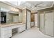 Bright bathroom features a large vanity with granite counters, hexagon tile flooring, and a glass-enclosed shower at 2975 Coles Way, Atlanta, GA 30350