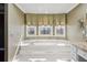 Bathroom with large soaking tub and three large windows at 2975 Coles Way, Atlanta, GA 30350