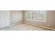Bedroom with neutral carpet and paint, and light-filled window at 2975 Coles Way, Atlanta, GA 30350