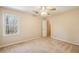 Bedroom with light neutral walls, carpeted floors and fan at 2975 Coles Way, Atlanta, GA 30350