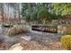 Stone entrance to Habersham Place neighborhood with mature trees and landscaping at 2975 Coles Way, Atlanta, GA 30350