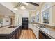 Well-appointed kitchen with a center island, granite countertops, and modern appliances at 2975 Coles Way, Atlanta, GA 30350