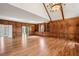Bright living room featuring hardwood floors, wood paneled walls, and custom built-ins at 2975 Coles Way, Atlanta, GA 30350