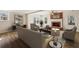 Cozy living room with a fireplace, comfortable seating, and ample natural light from multiple windows at 2975 Coles Way, Atlanta, GA 30350