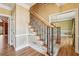 Traditional staircase with hardwood floors and decorative railing, leading to the upper level at 2975 Coles Way, Atlanta, GA 30350