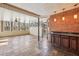 Cozy sunroom featuring slate floors, brick accent wall, and natural lighting at 2975 Coles Way, Atlanta, GA 30350