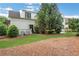 Landscaped backyard with lush greenery, a well-manicured lawn, and a charming patio at 3920 Cash Lndg, Marietta, GA 30066